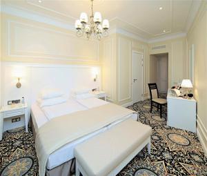 a hotel room with two beds and a large mirror at Rixwell Gertrude Hotel in Riga