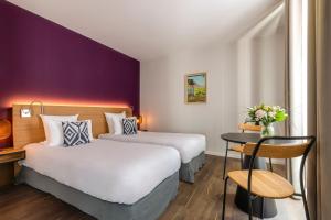 Katil atau katil-katil dalam bilik di Hotel Villa Koegui Biarritz