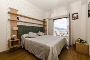 Un ou plusieurs lits dans un hébergement de l'établissement Splendid Hotel Taormina