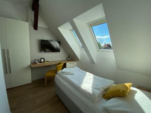 En eller flere senge i et værelse på Hotel Slavia