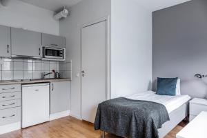 Säng eller sängar i ett rum på Part-Time Home Rotebro