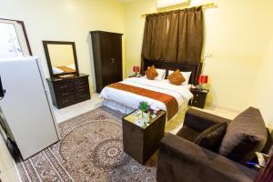 Łóżko lub łóżka w pokoju w obiekcie العييري للوحدات السكنية المفروشة الباحة 4