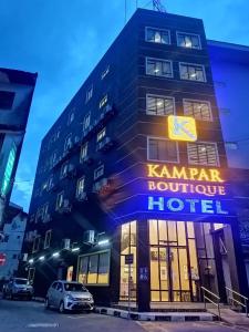 a building with a sign that reads karma boutique hotel at Kampar Boutique Hotel in Kampar
