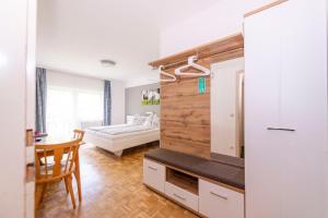 Postel nebo postele na pokoji v ubytování Gästehaus Genf