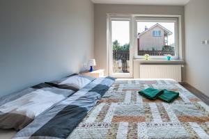 Posteľ alebo postele v izbe v ubytovaní Apartamenty Gdynia