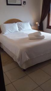 Ein Bett oder Betten in einem Zimmer der Unterkunft Villa 10418 in San Lameer Golf Estate