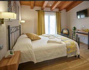 מיטה או מיטות בחדר ב-Il Beccaria Relais B&B