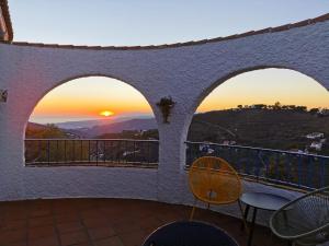 a view of the sunset from the balcony of a house at B&B la Madrugada in Cómpeta