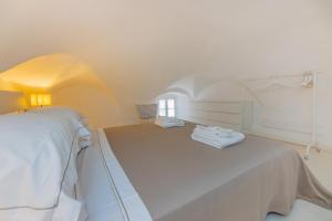 Säng eller sängar i ett rum på Le Casasse "Grecale"