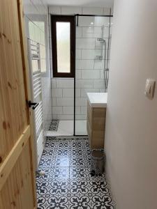 a bathroom with a shower and a sink at Drevenica Humno in Terchová +7 photos