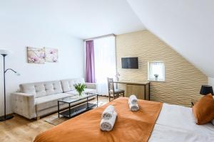 Postel nebo postele na pokoji v ubytování Pokoje, Noclegi, Apartamenty Dune Resort Łeba