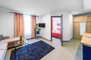 TV a/nebo společenská místnost v ubytování Pokoje, Noclegi, Apartamenty Dune Resort Łeba
