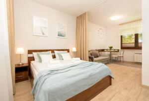 Postel nebo postele na pokoji v ubytování Apartamenty EWiTA