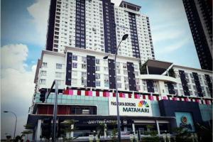 a large building with a sign in front of it at Cozy designer loft near KL city center in Ampang