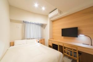 Postel nebo postele na pokoji v ubytování Nesthotel alt Kuramae Station