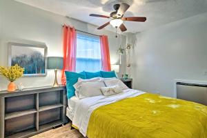 a bedroom with a bed and a ceiling fan at Bright Lakeside Studio - Hike, Fish, and Bike! in Golden