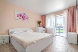 Postel nebo postele na pokoji v ubytování Flamingo Family Club