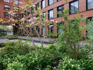 a building with flowering plants in front of a building at Studio-apartment in city-center in Amsterdam