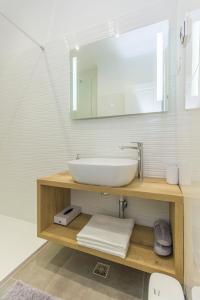 a bathroom with a sink and a mirror at Apartment Ena ,city center in Šibenik +23 photos