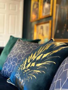 two pillows sitting on top of a couch at Apartment 'Boho' in Yeovil