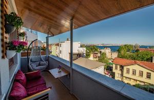 a balcony with a hammock and a view of the city at Duru Sultanahmet Apart & Suites in Istanbul