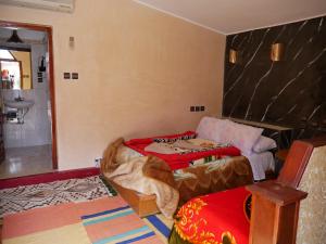 Un ou plusieurs lits dans un hébergement de l'établissement Hotel Baddou