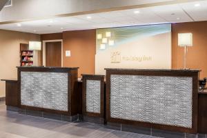 a lobby with two privacy screens in a store at Holiday Inn Rock Island-Quad Cities, an IHG Hotel in Rock Island