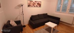 Posezení v ubytování FSQH UNDER Apartman