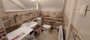 Koupelna v ubytování FSQH UNDER Apartman