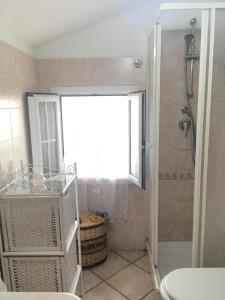 a bathroom with a shower and a sink at Panorama sul Mare in Noto Marina