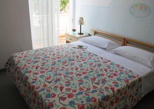 Postel nebo postele na pokoji v ubytování Hotel Villa Cecilia