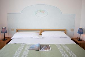 Postel nebo postele na pokoji v ubytování Hotel Villa Cecilia
