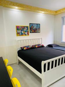 Giường trong phòng chung tại Apartamentos no Guarujá - Pitangueiras