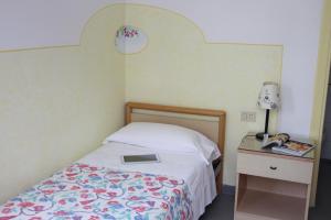 Postel nebo postele na pokoji v ubytování Hotel Villa Cecilia