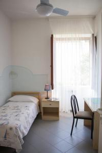 Postel nebo postele na pokoji v ubytování Hotel Villa Cecilia