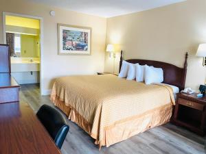 מיטה או מיטות בחדר ב-Relax Inn - Perry