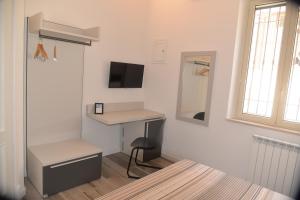 TV a/nebo společenská místnost v ubytování B&B I BRONZI