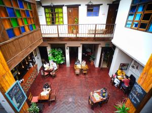 an overhead view of a restaurant with people sitting at tables at Hostal Restaurant La Cigale in Cuenca