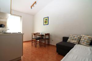 Postel nebo postele na pokoji v ubytování Apartmani i sobe Josica