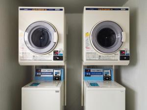 three washing machines and a washer and dryer at SHIRAHAMA KEY TERRACE SEAMORE RESIDENCE - Vacation STAY 35168v in Kanayama