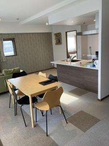 a kitchen and dining room with a table and chairs at A,T,HOTEL HAKATA - Vacation STAY 36414v in Fukuoka