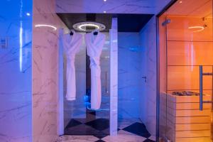 a bathroom with a toilet and a bathtub in it at Hotel & Spa Saint-Jacques in Paris