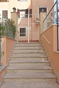 a set of stairs in front of a building at La Casa Felice a San Pietro in Rome