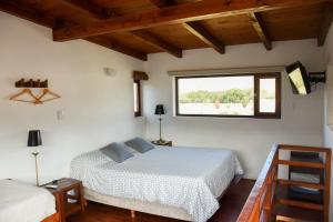 Una cama o camas en una habitación de Entre Montañas