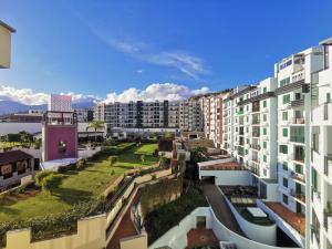 an aerial view of a city with buildings at Sun Island Apartments in Funchal