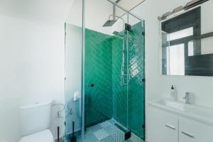 a bathroom with a shower and a toilet and a sink at Appartements - Centre Ville in Rabat