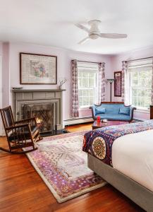 a bedroom with a bed and a fireplace at The Applewood Manor in Asheville