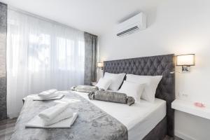 Posteľ alebo postele v izbe v ubytovaní Porta Aurea di Spalato, Luxury apartment