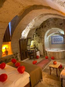A bed or beds in a room at Zuwinasa House Hotel