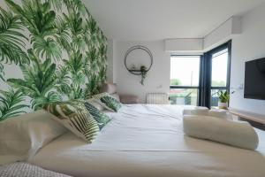 Posteľ alebo postele v izbe v ubytovaní Garden Fisterra - Jacuzzi, Jardín Privado y Vista Mar